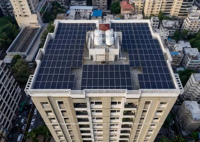 High-rise apartment complex with rooftop solar panels